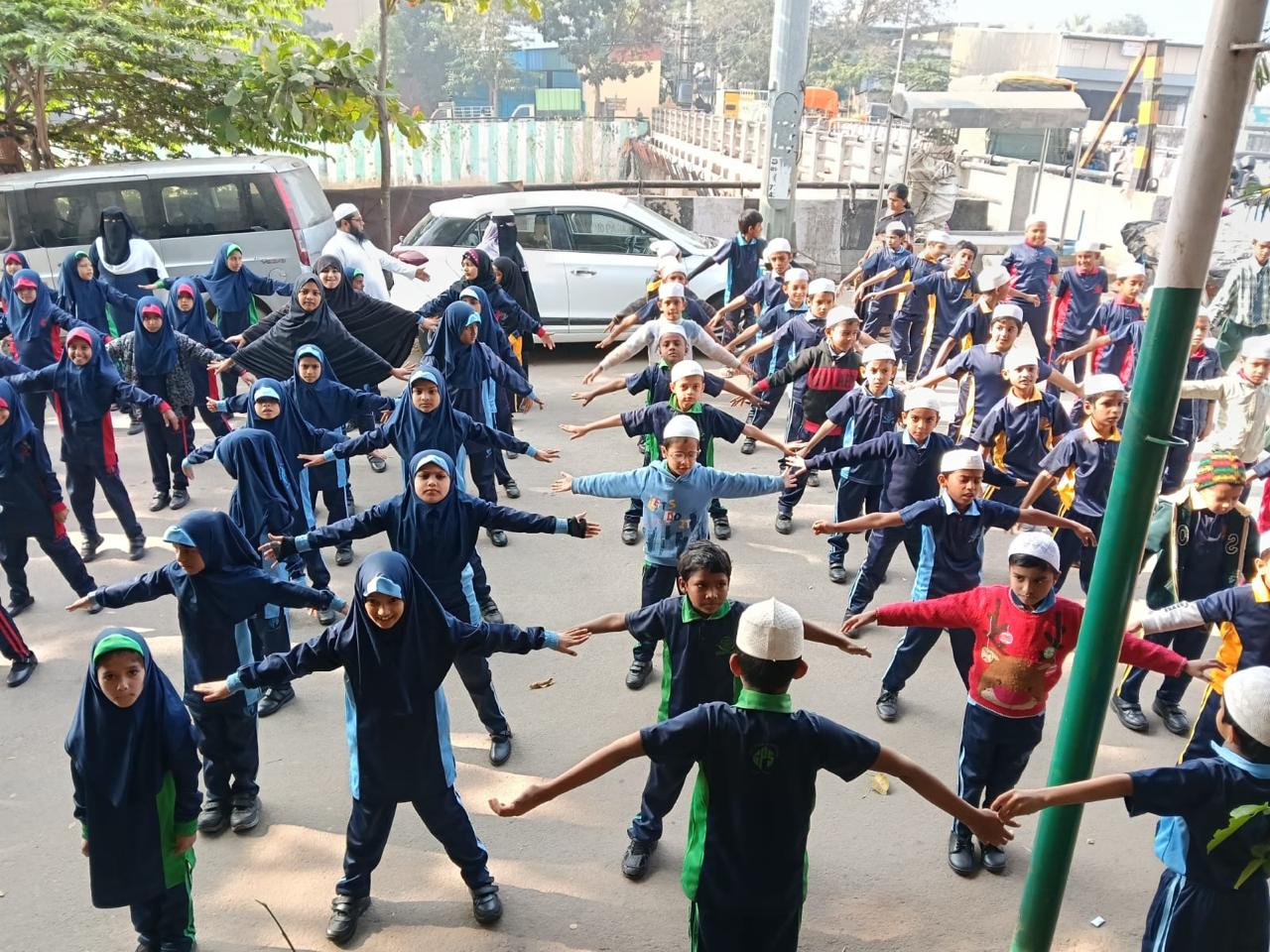 Children doing morning exercises outdoors