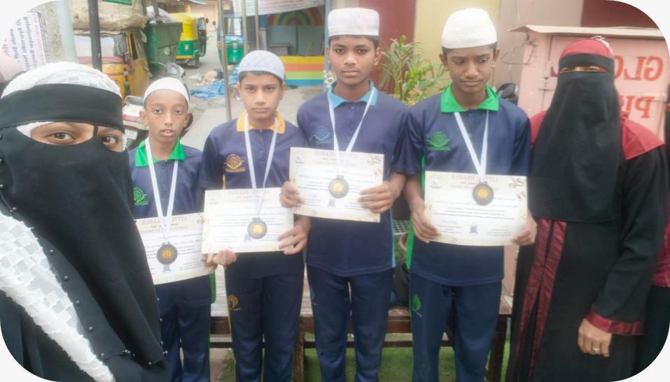 Students displaying certificates with teachers